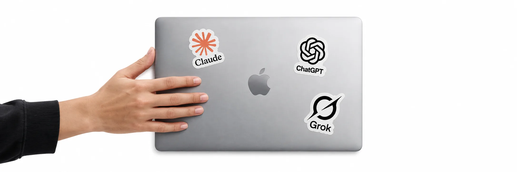 A laptop with Claude, ChatGPT and Grok stickers